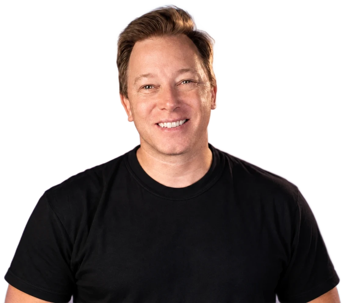 Mike Jackson, smiling, in a black T-shirt